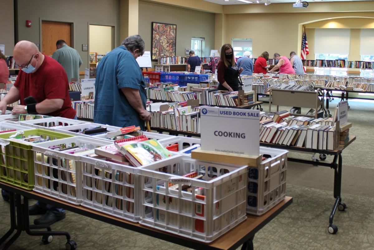 Patrons with masks shopping at the used book sale